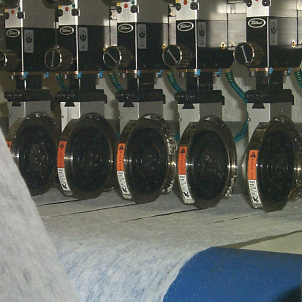 Shear cutting system for non wovens