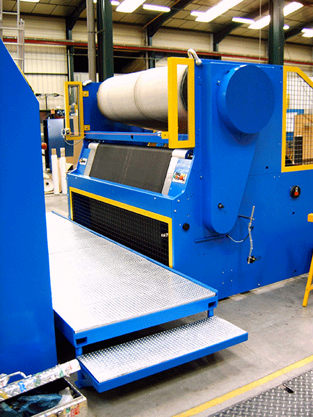 Liner rewinding on tire slitter rewinder